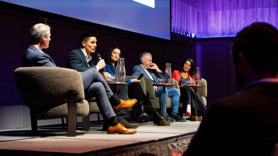 A panel of experts speaking at an event
