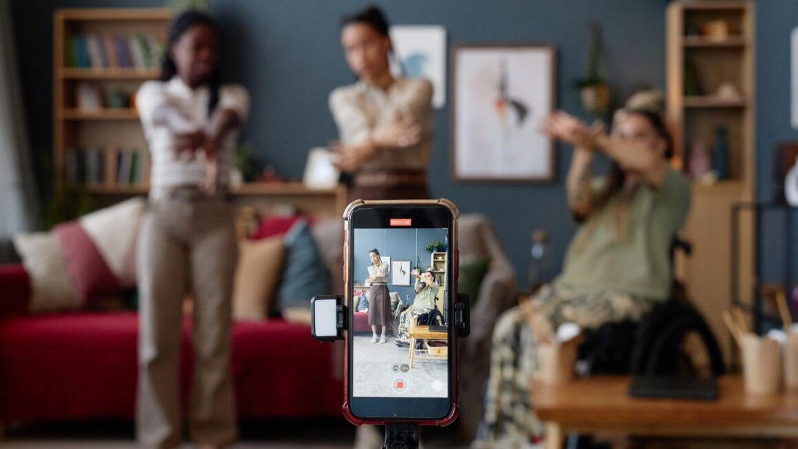 A smartphone records a small team videos