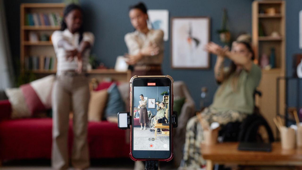 A smartphone records a small team videos